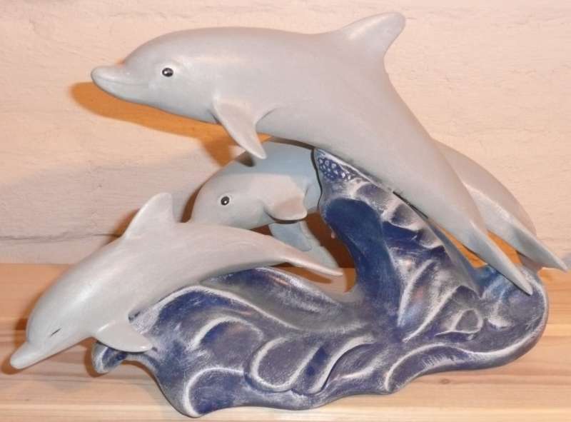 Drei Delphine springend